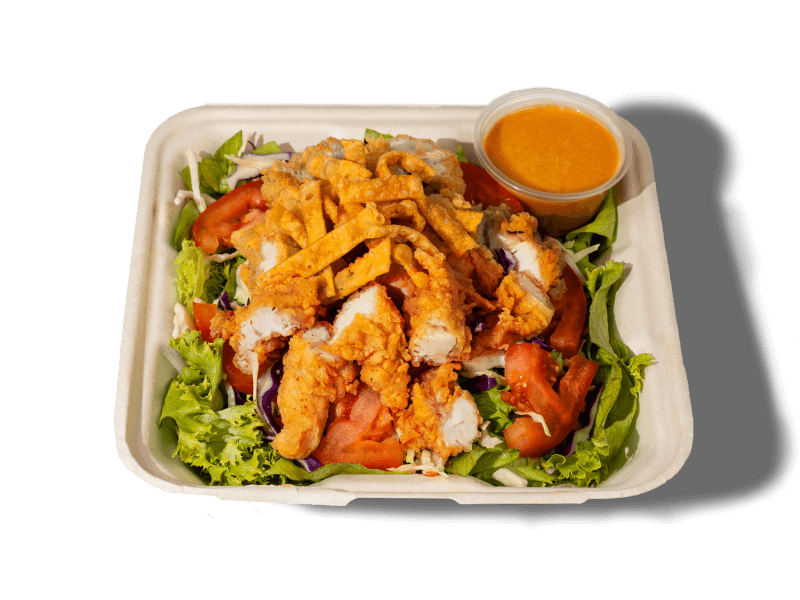 Enjoy our Crispy Chicken Salad with juicy fried chicken, fresh greens, and Asian cabbage slaw. A light and flavorful meal.