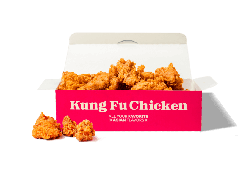 A box overflowing with crispy, juicy, bite-sized Asian Popcorn Chicken from our Kung Fu Chicken restaurant in Miami.
